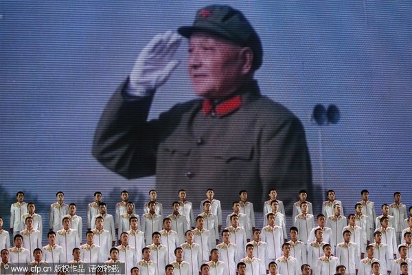 Singers perform during a gala show to celebrate the 90th anniversary of the founding of the Communist Party of China (CPC) an the Great Hall of the People on June 28, 2011 in Beijing.