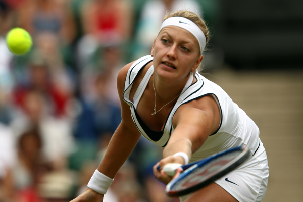 Petra Kvitova stretches for a forehand volley during her singles semifinal. [Sources: Wimbledon.com]