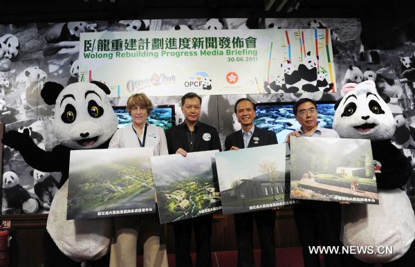 Photo taken on June 30, 2011 shows a press conference for Giant Panda Disease Control Center in Hong Kong, south China, June 30, 2011. Giant Panda Conservation and Disease Control Center in Dujiangyan and the China Conservation and Research Center for Giant Pandas in Wolong supported by Ocean Park Conservation Foundation and Hong Kong SAR's Development Bureau will be completed in early 2012 and early 2013 respectively. (Xinhua/Song Zhenping)(xzj) 