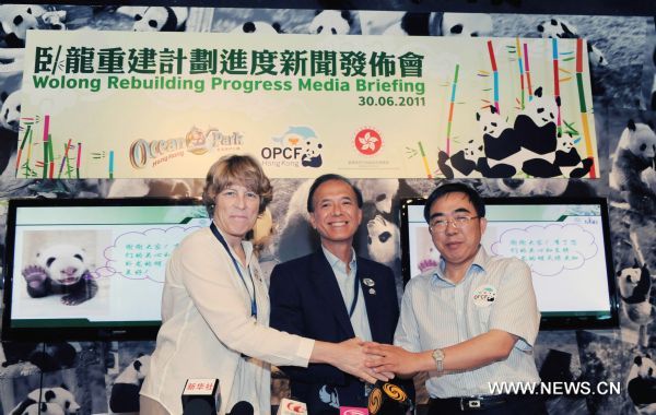 Photo taken on June 30, 2011 shows a press conference for Giant Panda Disease Control Center in Hong Kong, south China, June 30, 2011. Giant Panda Conservation and Disease Control Center in Dujiangyan and the China Conservation and Research Center for Giant Pandas in Wolong supported by Ocean Park Conservation Foundation and Hong Kong SAR's Development Bureau will be completed in early 2012 and early 2013 respectively. (Xinhua/Song Zhenping)(xzj) 