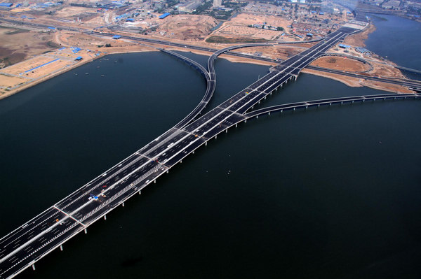 China's Jiaozhou Bay Bridge, the world's longest cross-sea bridge, linking the eastern port city of Qingdao and the offshore island Huangdao, opens on June 30, 2011.