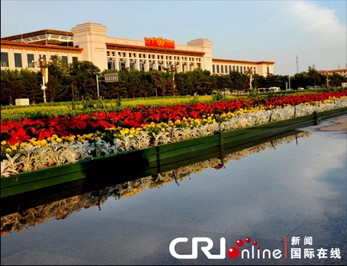 Flower decorations before the Great Hall of the People in Beijing on June 30 as a celebration for the 90th anniversary of the founding of the Communist Party of China (CPC). 