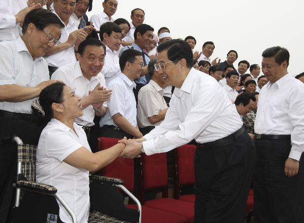 Chinese Presient Hu Jintao (2nd R) and Vice President Xi Jinping (1st R) meet with exemplary members of the Communist Party of China (CPC) ahead of a symposium to commemorate the 90th founding anniversary of the CPC in Beijing, capital of China, July 2, 2011. [Xinhua]
