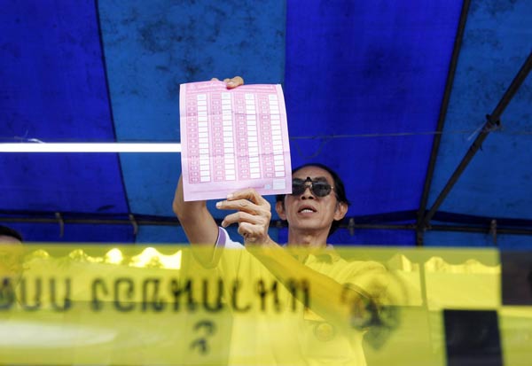 Thaksin party wins Thai election by a landslide: polls