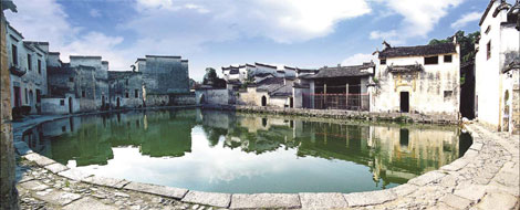 The half-moon shaped pond, named Yuezhao pond, is the center of Hongcun and it is here that village activities revolve, even up to now. Provided to China Daily