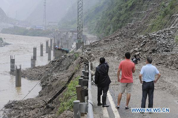 Photo taken on July 4, 2011 shows a highway damaged by rain-triggered mudslides in Wenchuan County, southwest China&apos;s Sichuan Province, July 4, 2011. 