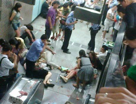 Several people were seen lying on the ground -- apparently after falling down from the escalator -- and were helped by others. Blood can be seen on the floor.