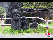 Stone figures made of local volcanic rock. These figures will bless people to prosper and multiply, locals say. [François Chen / China.org.cn]