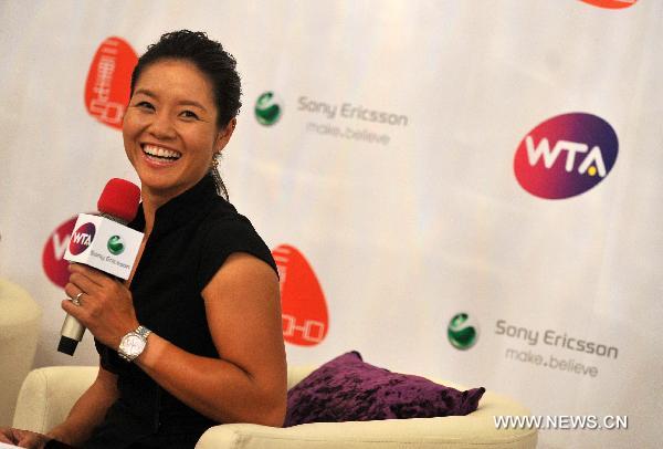 Li Na of China, the first Asian to win a Grand Slam title at the French Open, is interviewed by reporters before a celebration organized by the Women's Tennis Association (WTA) at Sanlitun SOHO in Beijing, China, July 5, 2011. (Xinhua/Gong Lei)