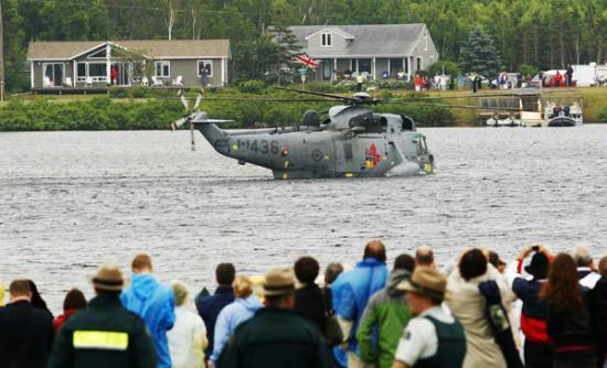 Britain's Prince William conducts a Waterbird emergency landing demonstration in a Canadian Sea King helicopter on a lake at Dalvay-By-The-Sea, Prince Edward Island, July 4, 2011.