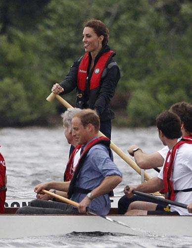 Britain's Prince William and his wife Catherine, Duchess of Cambridge, compete in a dragon boat race in Dalvay-by-the-sea, July 4, 2011.