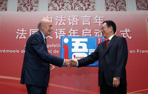 He Guoqiang (R), a member of the Standing Committee of the Political Bureau of the Communist Party of China (CPC) Central Committee and secretary of the CPC Central Commission for Discipline Inspection, shakes hands with former French president Valery Giscard d'Estaing at the launching ceremony of 'the Chinese Language Year program in France' in Paris, France, July 4, 2011.