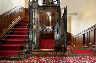 The original OTIS elevator was commissioned by shareholder William O'Hara and installed in 1924 when an additional building was joined to the existing 1863 Astor Hotel. It is the first elevator ever in China, and also the first by OTIS. The elevator is still in use today. [Photo for chinadaily.com.cn] 