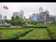 Located in the Ningbo City Center, Tianyi Square is the city's biggest square with an area of 193,000 square meters, 32 percent of which are the green belts. As the one-stop shopping, entertainment and commercial plaza, it is known as the 'Business Aircraft Carrier of Ningbo' and 'name card' of the city. [Cindy Chan/China.org.cn]