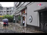 Located in the Ningbo City Center, Tianyi Square is the city's biggest square with an area of 193,000 square meters, 32 percent of which are the green belts. As the one-stop shopping, entertainment and commercial plaza, it is known as the 'Business Aircraft Carrier of Ningbo' and 'name card' of the city. [Cindy Chan/China.org.cn]
