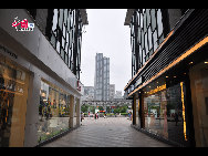 Located in the Ningbo City Center, Tianyi Square is the city's biggest square with an area of 193,000 square meters, 32 percent of which are the green belts. As the one-stop shopping, entertainment and commercial plaza, it is known as the 'Business Aircraft Carrier of Ningbo' and 'name card' of the city. [Cindy Chan/China.org.cn]