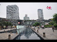Located in the Ningbo City Center, Tianyi Square is the city's biggest square with an area of 193,000 square meters, 32 percent of which are the green belts. As the one-stop shopping, entertainment and commercial plaza, it is known as the 'Business Aircraft Carrier of Ningbo' and 'name card' of the city. [Cindy Chan/China.org.cn]