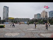 Located in the Ningbo City Center, Tianyi Square is the city's biggest square with an area of 193,000 square meters, 32 percent of which are the green belts. As the one-stop shopping, entertainment and commercial plaza, it is known as the 'Business Aircraft Carrier of Ningbo' and 'name card' of the city. [Cindy Chan/China.org.cn]