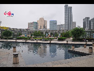 Located in the Ningbo City Center, Tianyi Square is the city's biggest square with an area of 193,000 square meters, 32 percent of which are the green belts. As the one-stop shopping, entertainment and commercial plaza, it is known as the 'Business Aircraft Carrier of Ningbo' and 'name card' of the city. [Cindy Chan/China.org.cn]