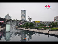 Located in the Ningbo City Center, Tianyi Square is the city's biggest square with an area of 193,000 square meters, 32 percent of which are the green belts. As the one-stop shopping, entertainment and commercial plaza, it is known as the 'Business Aircraft Carrier of Ningbo' and 'name card' of the city. [Cindy Chan/China.org.cn]