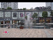 Located in the Ningbo City Center, Tianyi Square is the city's biggest square with an area of 193,000 square meters, 32 percent of which are the green belts. As the one-stop shopping, entertainment and commercial plaza, it is known as the 'Business Aircraft Carrier of Ningbo' and 'name card' of the city. [Cindy Chan/China.org.cn]