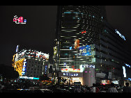 Located in the Ningbo City Center, Tianyi Square is the city's biggest square with an area of 193,000 square meters, 32 percent of which are the green belts. As the one-stop shopping, entertainment and commercial plaza, it is known as the 'Business Aircraft Carrier of Ningbo' and 'name card' of the city. [Cindy Chan/China.org.cn]