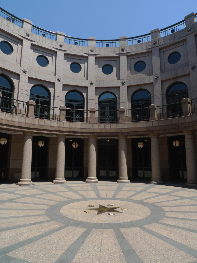 The courtyard of the Texas State Capitol of the US. The star on the floor is surrounded by the characters 'TEXAS'. Standing on one of Austin's highest points, the Capitol is an extraordinary example of public architecture of the late 19th century and is widely recognized as one of the country's most distinguished state capitols. [Photo by Xu Lin/China.org.cn]