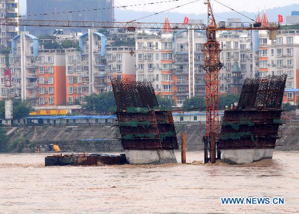 Photo taken on July 7, 2011 shows a semifinished pier in Nanchong section of Jialing River, southwest China&apos;s Sichuan Province. The Nanchong section of Jialing River witnessed the second flood peak this year on Thursday. [Xinhua]