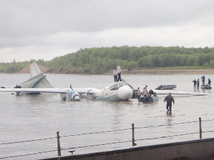 The damaged AN-24 plane, owned by the Angara Airlines, is seen after a hard landing on the surface of the Ob river in Tomsk region in western Siberia July 11, 2011. The plane, which flew from Tomsk to Surgut, had 37 people onboard. 