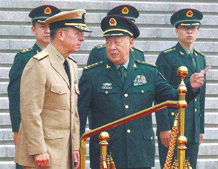 General Chen Bingde, chief of the general staff of the People's Liberation Army, greets Admiral Mike Mullen, chairman of the US Joint Chiefs of Staff, at a welcome ceremony on Monday at army headquarters in Beijing.