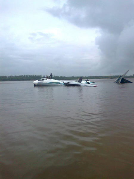 The damaged AN-24 plane, owned by the Angara Airlines, is seen after a hard landing on the surface of the Ob river in Tomsk region in western Siberia July 11, 2011. 