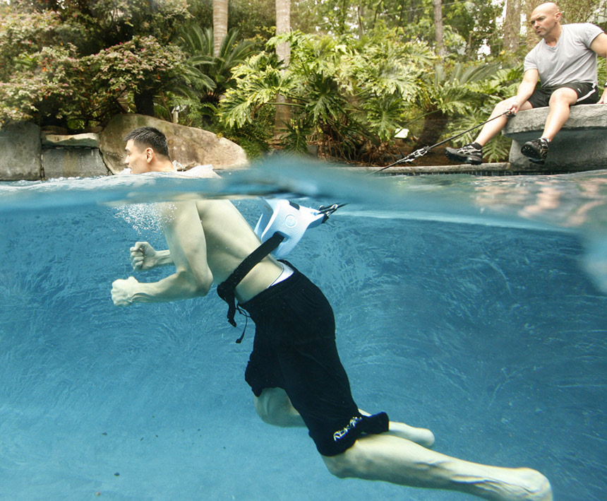  Yao Ming gets in the pool for recovery training with his personal trainer, Anthony Falsone.