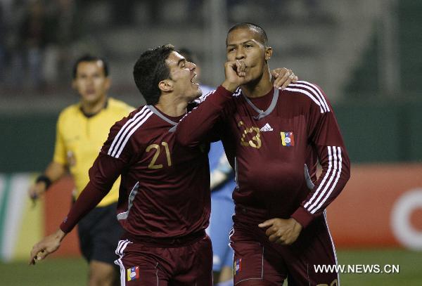 Venezuela's Salomon Rondon (R) and Alexander Gonzalez celebrate victory against Paraguay during the match for the group stage of Copa America 2011, in Salta, Argentina, on July 13, 2011. (Xinhua/Santiago Pandolfi) 