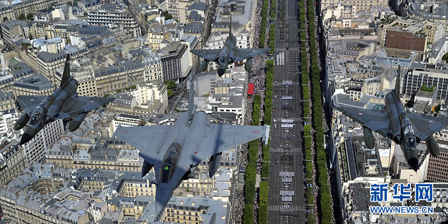 A French Rafale jet flies over the Paris Arch of Triumph (Arc de Triomphe) accompanied by three Mirage 2000-N on July 14, 2011 during the Bastille Day military parade. 