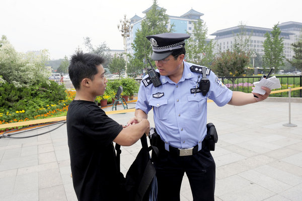 Zhang was driven away from Beijing's Wangfujing street for his unauthorized street performance on July 14, 2011. 