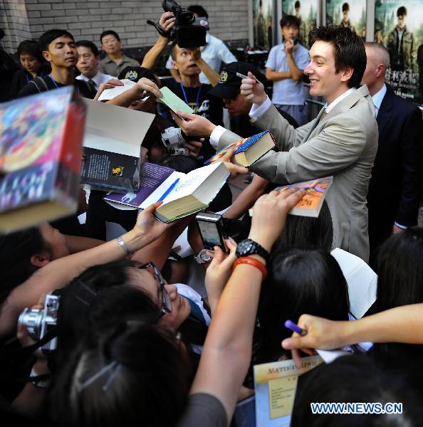 Cast member of 'Harry Potter and the Deathly Hallows - Part 2' Olive Phelps interacts with fans in Hong Kong, south China, July 16, 2011.