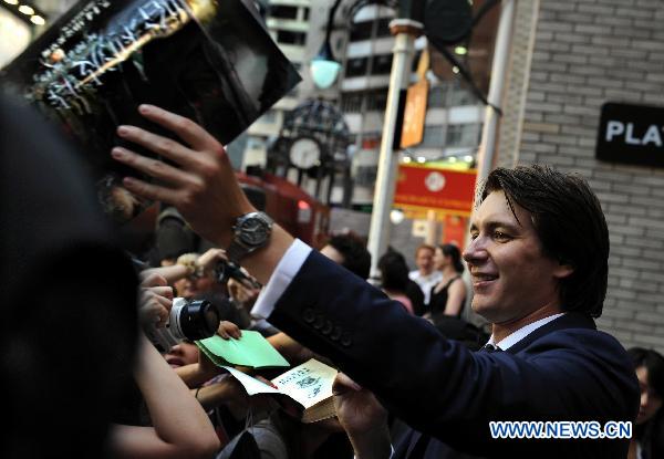 Cast members of 'Harry Potter and the Deathly Hallows - Part 2' James Phelps interacts with fans in Hong Kong, south China, July 16, 2011. James and Olive Phelps came to Hong Kong on Saturday to promote the movie 'Harry Potter and the Deathly Hallows - Part 2.'