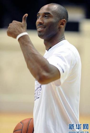 NBA basketball player Kobe Bryant of the Los Angeles Lakers meets fans upon his arrival at a stadium during his 2011 China Tour in Changsha, Central China's Hunan province, July 16, 2011.