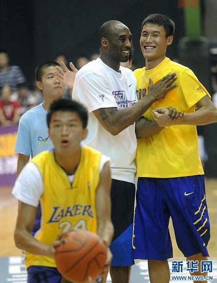 NBA basketball player Kobe Bryant of the Los Angeles Lakers meets fans upon his arrival at a stadium during his 2011 China Tour in Changsha, Central China's Hunan province, July 16, 2011.