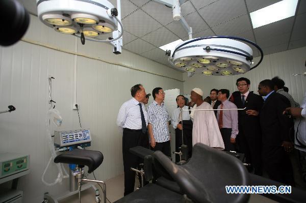 Chinese Ambassador to Sudan Li Chengwen (2nd L) and some officials from China visit at the China-Sudan Friendship Hospital for Maternity and Child Care in Gezira state, Sudan, July 16, 2011. Sudan's central Gezira state and the Sudanese ministry of health on Saturday celebrated the inauguration of the China-Sudan Friendship Hospital for Maternity and Child Care in Abu Ushar area, which was built in cooperation with China Foundation for Poverty Alleviation (CFPA). 