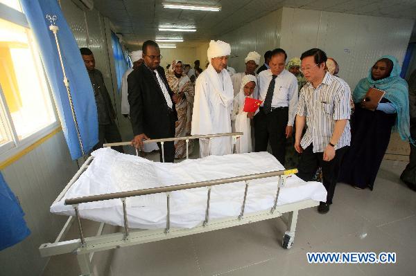 Chinese Ambassador to Sudan Li Chengwen (1st R, Front) and some officials from China visit at the China-Sudan Friendship Hospital for Maternity and Child Care in Gezira state, Sudan, July 16, 2011. Sudan's central Gezira state and the Sudanese ministry of health on Saturday celebrated the inauguration of the China-Sudan Friendship Hospital for Maternity and Child Care in Abu Ushar area, which was built in cooperation with China Foundation for Poverty Alleviation (CFPA). 