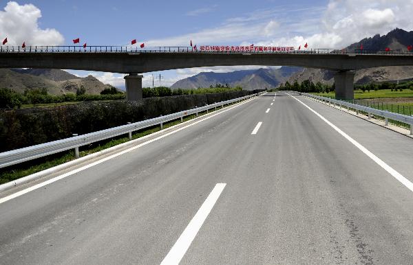 Photo taken on July 7, 2011 shows the first expressway of southwest China's Tibet Autonomous Region, in Lhasa, capital of Tibet. Tibet's first expressway, a 37.8 kilometers long, four-lane road, were put into service on Sunday, linking Lhasa's city center with Gonggar Airport in the neighboring Shannan Prefecture. 