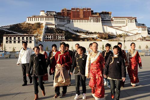 The government will help the Tibet University to grow into an internationally-recognized university. In this file photo, Tibetan students from the Tibet University who get financial aid from the government walk on the Potala Palace Square. 