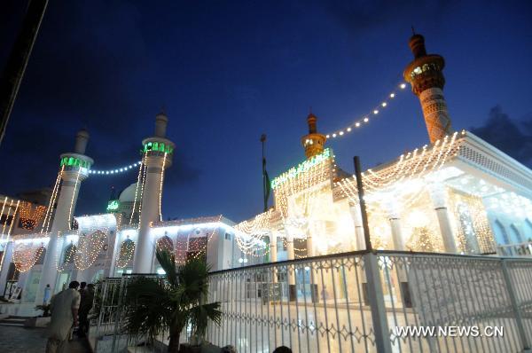 The illuminated mosque is seen during the Shab-e-Barat Festival in Karachi, a port city in southern Pakistan, July 17, 2011. Muslims visit ancestral graveyards for the salvation of the departed souls and also believe that all sins will be forgiven by praying to Allah throughout the Shab-e-Barat night. [Xinhua Photo/Masroor]