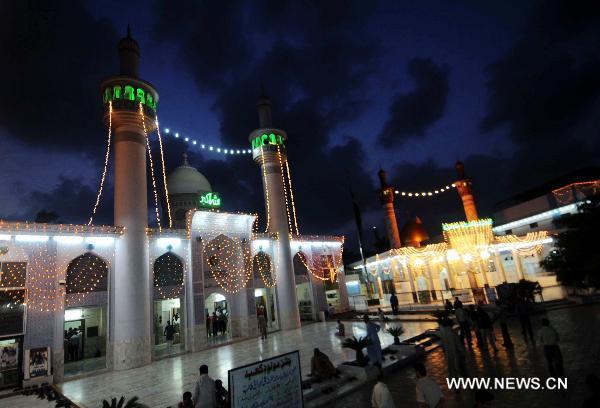 The illuminated mosque is seen during the Shab-e-Barat Festival in Karachi, a port city in southern Pakistan, July 17, 2011. Muslims visit ancestral graveyards for the salvation of the departed souls and also believe that all sins will be forgiven by praying to Allah throughout the Shab-e-Barat night. [Xinhua Photo/Masroor]