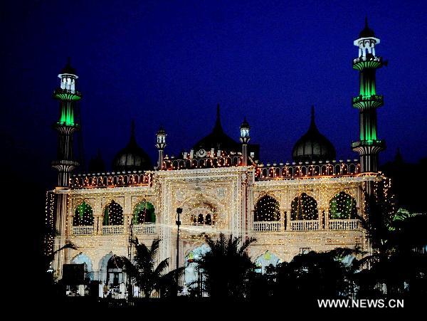 The illuminated mosque is seen during the Shab-e-Barat Festival in Karachi, a port city in southern Pakistan, July 17, 2011. Muslims visit ancestral graveyards for the salvation of the departed souls and also believe that all sins will be forgiven by praying to Allah throughout the Shab-e-Barat night. [Xinhua Photo/Masroor]