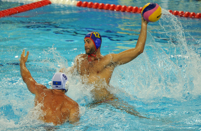 Spain and Kazakhstan compete in their group A men's water polo preliminary round match at the natatorium of the Oriental Sports Center, on July 18, 2011, in Shanghai.