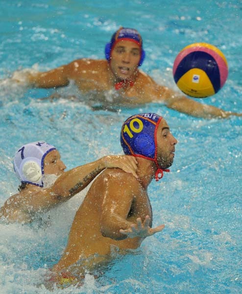 Spain and Kazakhstan compete in their group A men's water polo preliminary round match at the natatorium of the Oriental Sports Center, on July 18, 2011, in Shanghai.