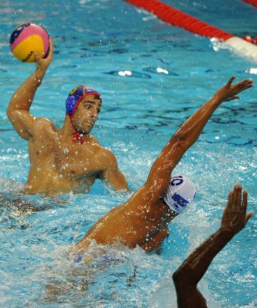 Spain and Kazakhstan compete in their group A men's water polo preliminary round match at the natatorium of the Oriental Sports Center, on July 18, 2011, in Shanghai.