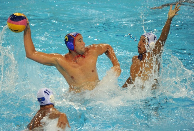 Spain and Kazakhstan compete in their group A men's water polo preliminary round match at the natatorium of the Oriental Sports Center, on July 18, 2011, in Shanghai.